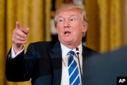 FILE - President Donald Trump speaks in the East Room of the White House in Washington during a meeting with House Republicans about a proposed health bill, March 7, 2017.