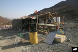 The research tent of the Oman Drilling Project is pictured in the al-Hajjar mountains of Oman, March 1, 2017. Geologists are searching for an efficient and cheap way to remove carbon dioxide from the air and oceans.