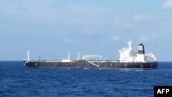 This handout photo received on August 25 from the Indonesian Navy shows the Bahamian-flagged MT. Strovolos near the Riau islands. The tanker and its crew who were wanted on charges of stealing nearly 300,000 barrels of crude oil from Cambodia's reserves. (AFP/INDONESIA NAVY)