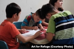 Children participate in the Art for Refuge program at Roshan Learning Center in Jakarta, Indonesia. Indonesia does not deport asylum seekers and refugees back to potential danger.
