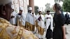 Clergy line the steps of the Holy Trinity Cathedral as White House senior adviser Ivanka Trump, right, arrives for a ceremony honoring the victims of the Ethiopian Airlines crash, Monday April 15, 2019, in Addis Ababa, Ethiopia.