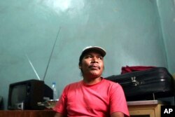 FILE - In this May 31, 2003 file photo, jailed anti-logging activist Isidro Baldenegro, 39, speaks to a reporter at the Parral prison, south of the U.S. border in Mexico.