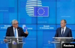 European Commission President Jean-Claude Juncker and European Council President Donald Tusk hold a news conference at the European Union leaders summit in Brussels, Belgium, Oct. 18, 2018.