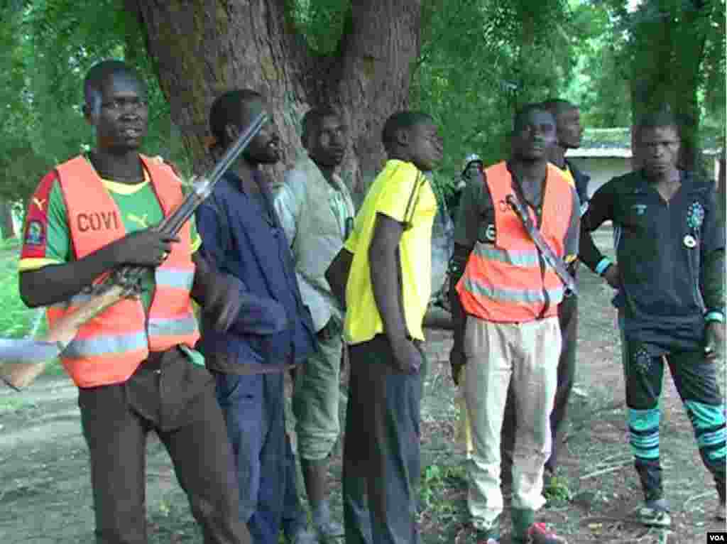 Members of self-defense groups are seen guarding a school at Fotokol, Cameroon. (M.E. Kinzeka/VOA)