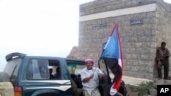 Flags of the former South Yemen are illegal in Yemeni cities, but the government does not control much of the Southern countryside; flags like this one are painted on mountainsides, rocks and buildings