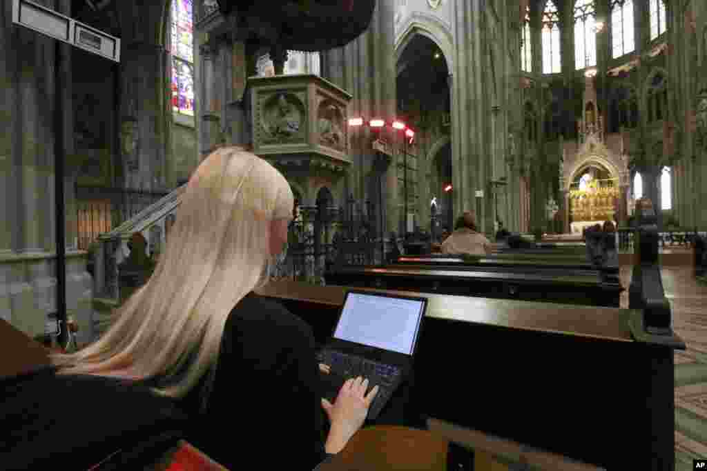 Students attend lectures via a video stream in the neo-gothic church &#39;Votivkirche&#39; in Vienna, Austria.&nbsp;Due to the COVID-19 pandemic the church was converted into an auditorium for the university of Vienna.&nbsp;