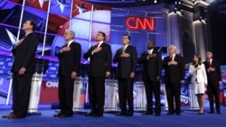 From left, Rick Santorum, Ron Paul, Rick Perry, Mitt Romney, Herman Cain, Newt Gingrich, Michele Bachmann and Jon Huntsman during the national anthem