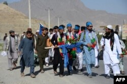 Afghan peace activists, marching from Nangarhar in demand to an end to the war, arrive in Kabul, June 25, 2018.