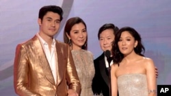 FILE - Henry Golding, from left, Michelle Yeoh, Ken Jeong and Constance Wu, nominated for outstanding performance by a cast in a motion picture, introduce a clip from their film "Crazy Rich Asians" at the 25th annual Screen Actors Guild Awards at the Shri