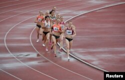 FILE - These runners fight for a good place on the inside track. This race is the women's 800 meters at the 58th Brothers Znamensky Memorial track and field meet, June 4, 2016. (REUTERS/Sergei Karpukhin)