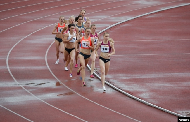 FILE - These runners fight for a good place on the inside track. This race is the women's 800 meters at the 58th Brothers Znamensky Memorial track and field meet, June 4, 2016. (REUTERS/Sergei Karpukhin)