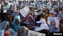 People attend a campaign rally for presidential candidate Boydiel Ould Houmeid in Nouakchott, Mauritania, June 18, 2014.