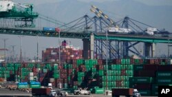 Containers are stacked at the Port of Los Angeles in Los Angeles, Oct. 1, 2021