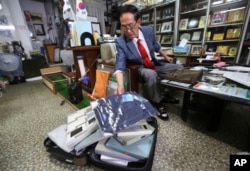 Yoon Heung-kyu, 91, shows some gifts for his family members in North Korea during an interview at his office in Seoul, South Korea, Aug. 16, 2018. Yoon will travel to North Korea Monday with other South Koreans to see family members they haven’t seen for decades.