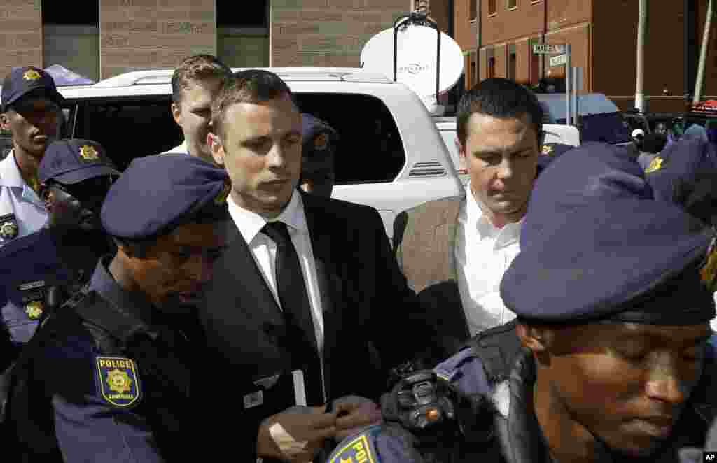 Oscar Pistorius arrives at the high court in Pretoria, South Africa, Oct. 13, 2014.