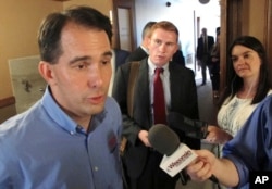 Wisconsin Gov. Scott Walker speaks to the media Tuesday, Aug. 1, 2017, in Madison, Wis.