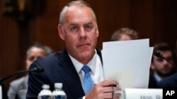 Interior Secretary Ryan Zinke arrives for a Senate Appropriations subcommittee hearing on the fiscal 2019 budget, May 10, 2018, on Capitol Hill in Washington.