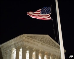 A U.S. flag flies at half-staff in front of the U.S. Supreme Court in Washington, Feb. 13, 2016, after is was announced that Supreme Court Justice Antonin Scalia, 79, had died.