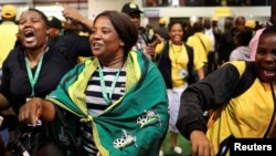 African National Congress (ANC) members react at the end of the 54th National Conference at the Nasrec Expo Centre in Johannesburg, South Africa, Dec. 21, 2017. 