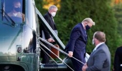 President Donald Tump arrives at Walter Reed National Military Medical Center on Friday. Oct. 2, 2020.