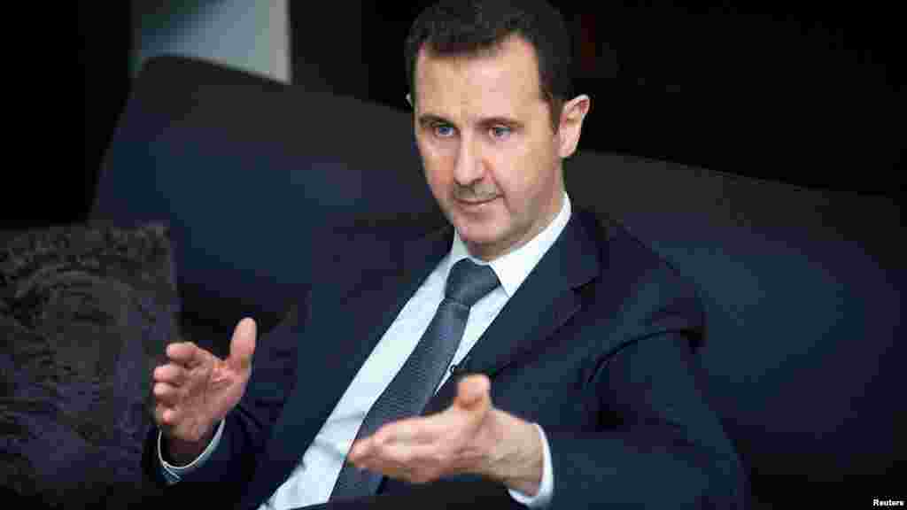 Syrian President Bashar al-Assad gestures during an interview in Damascus in this in this handout photo distributed by Syria's national news agency SANA on September 2, 2013.