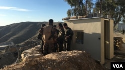 Iraqi Kurdish Peshmerga soldiers huddle around Maj. Gen. Sirwan Barzani in Makhmur, Iraq. Makhmur is expected to serve as one of the staging points for Iraqi and Peshmerga forces in the advance against the Islamic State-controlled city of Mosul, March 8, 2016. The Iraqis are being supported by an all-American fire base.