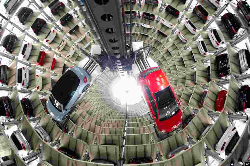 A New Beetle Cabrio, (L) and a Golf VII photographed in the elevators of the storage of German Volkswagen car producer in Wolfsburg, northern Germany.