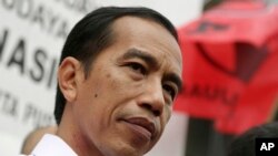 Kandidat presiden Joko Widodo dalam sebuah kampanye di Jakarta (16/3). (AP/Achmad Ibrahim)
