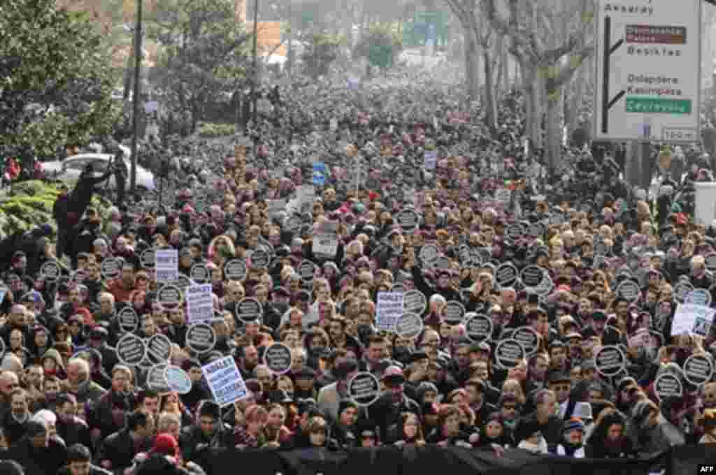 Tens of thousands of protesters march to mark the fifth anniversary of Turkish-Armenian journalist Hrant Dink's murder in Istanbul, Turkey, Thursday, Jan. 19, 2012 as outrage continues to grow over a trial that failed to shed light on alleged official neg