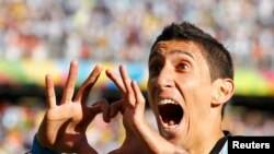 Argentina's Angel Di Maria celebrates scoring against Switzerland during extra time in their 2014 World Cup round of 16 game at the Corinthians arena in Sao Paulo July 1, 2014. REUTERS/Ivan Alvarado (BRAZIL - Tags: SOCCER SPORT WORLD CUP TPX IMAGES OF TH