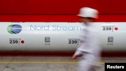 FILE PHOTO: The logo of the Nord Stream 2 gas pipeline project is seen on a pipe at the Chelyabinsk pipe rolling plant in Chelyabinsk, Russia, February 26, 2020. REUTERS/Maxim Shemetov/File Photo