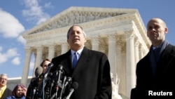 FILE - Texas Attorney General Ken Paxton addresses reporters on the steps of the U.S. Supreme Court in Washington, March 2, 2016.