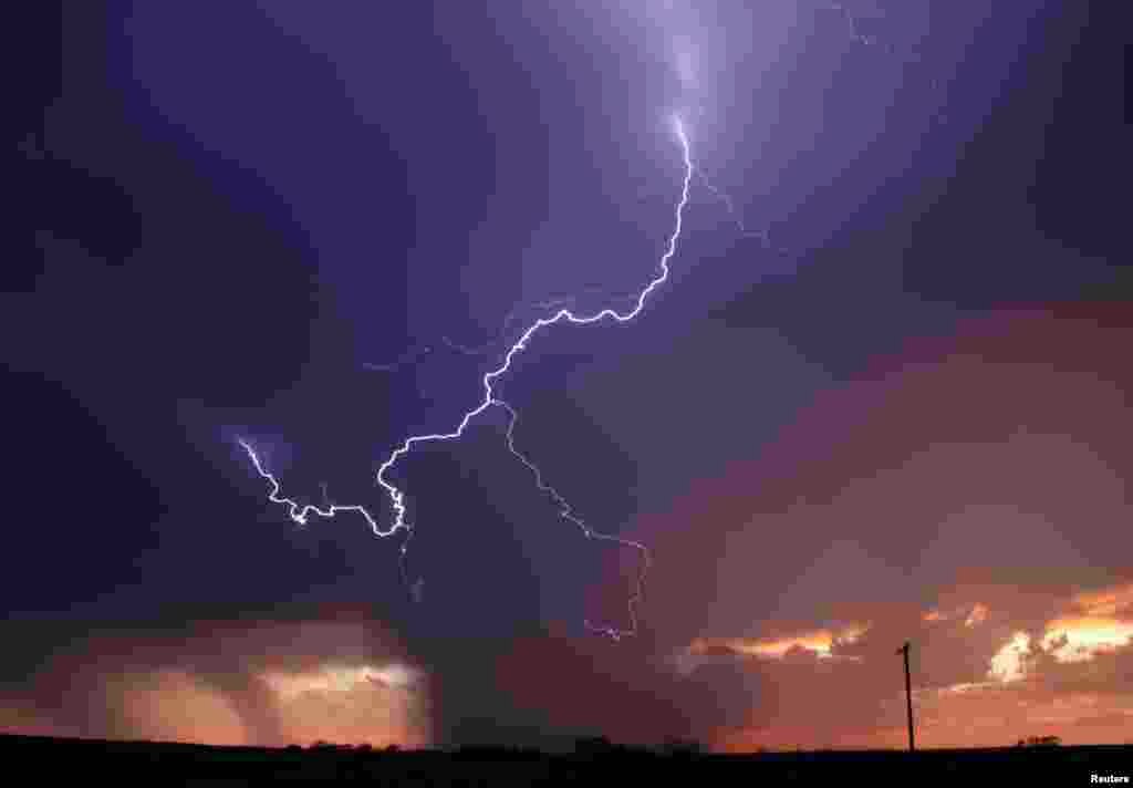 Huge lightning strikes cross the skies as thunderstorm supercells pass through areas in Archer City, Texas,&nbsp; April 23, 2014.