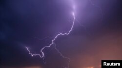 FILE - Lightning strikes cross the skies as thunderstorms pass through Archer City, Texas, April 23, 2014. Severe storms are expected to hit the South on Jan. 10, 2020, forecasters said.