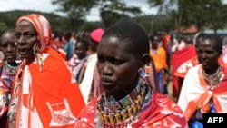 FILE - Kenyan Maasai women gather during a meeting dedicated to the practice of female genital mutilation (FGM) in which several participants voiced opposition to a ban currently in place, June 12, 2014, in Enkorika, Kajiado, 75km from Nairobi. 