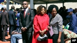 Simba Chikore, Bona Mugabe Chikore and a relative at the late Robert Mugabe's funeral.