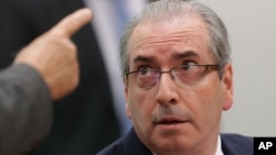 FILE - Brazil's suspended lower house speaker, Eduardo Cunha, listens to a questioner during an ethics committee hearing in parliament in Brasilia, May 19, 2016.