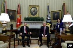 FILE - President Donald Trump meets with Turkish President Recep Tayyip Erdogan in the Oval Office of the White House in Washington, May 16, 2017.