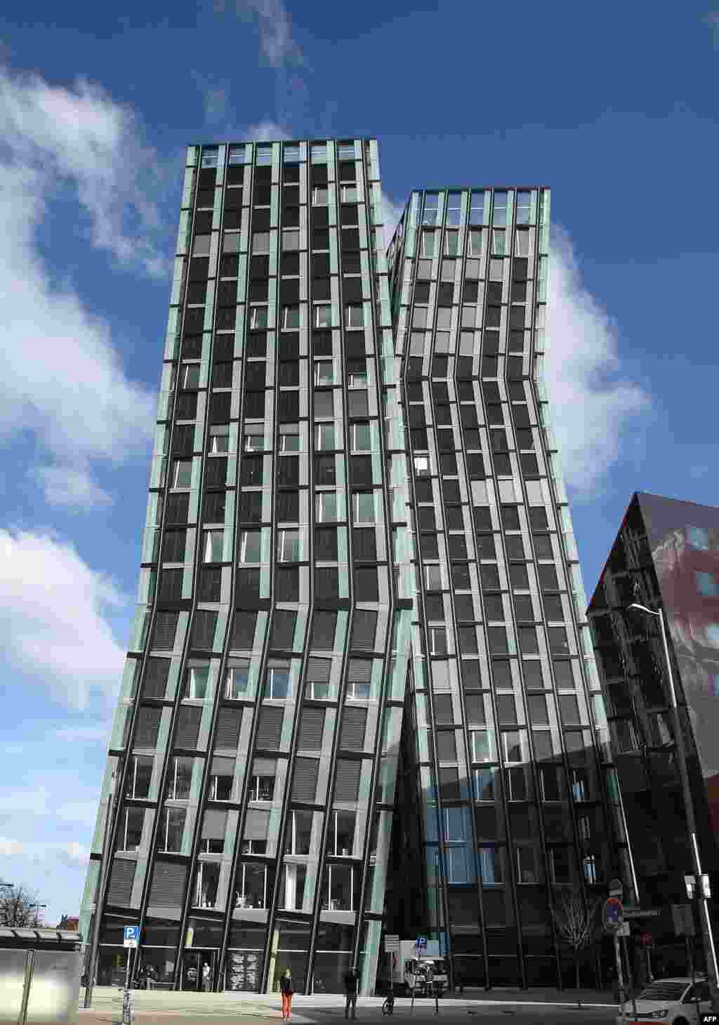 An outside view shows the &quot;Dancing Towers&quot; (Tanzende Tuerme), a new architectural landmark and office building by Hadi Teherani in Hamburg, northern Germany, Apr. 4, 2013. 