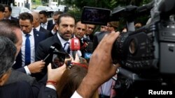 Lebanese Prime Minister-designate Saad al-Hariri speaks to the media in front of the Special Tribunal for Lebanon ahead of the closings arguments in the trial of Lebanon's Rafik al-Hariri alleged killers in the Hague, the Netherlands, Sept. 11, 2018. 