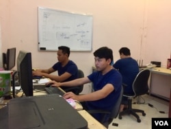 ​Cambodian developers work at the Coder Studio, a technology startup in Battambang City, Battambang Province, February 16, 2017. The Coder Studio is an eight-month old, eight-member team and one of the first technology startups based in Cambodia’s agricultural province of Battambang. (Sophat Soeung/VOA Khmer)