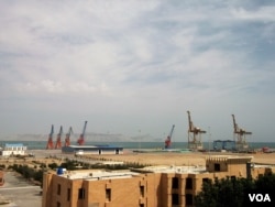 Cranes designed to hoist shipping containers onto cargo ships are already in place at the pier in Gwadar, where a major seaport is being built with Chinese backing. (N. Hoodbhoy/VOA)