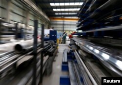 Laborers work at the Gottert machinery and tools plant factory in Garin, Argentina, May 20, 2016.