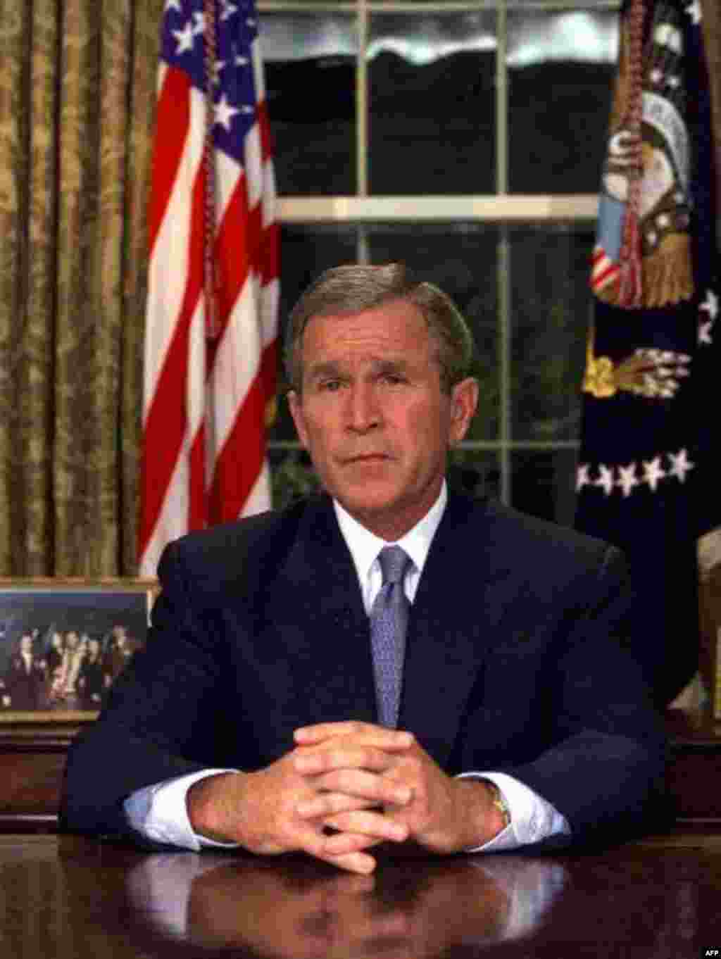 U.S. President George W. Bush addresses the nation from the Oval Office about the terrorist attacks at the World Trade Center and the Pentagon, Tuesday, Sept. 11, 2001. Bush said "Freedom itself has been attacked this morning by a faceless coward." (AP P
