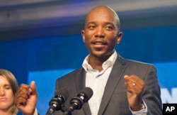 FILE - Newly elected Democratic Alliance (DA) party leader Mmusi Maimane, delivers his victory speech after being elected leader, May 10, 2015 in Port Elizabeth, South Africa.