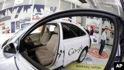FILE: A Google self-driving car is on exhibit at the Computer History Museum in Mountain View, Calif. on May 14, 2014. On June 21, 2023, German regulators said they were examining Google for possible violations of that nation's fair competition laws.
