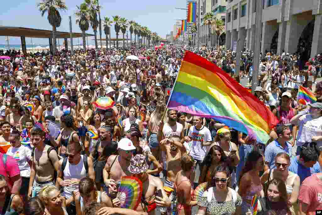 Tens of thousands of people participate in the annual Pride Parade, in Tel Aviv, Israel. 