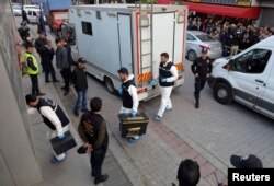 Turkish police forensic experts arrive at a car park where a vehicle belonging to Saudi Arabia's consulate was found, in Istanbul, Turkey, Oct. 22, 2018.