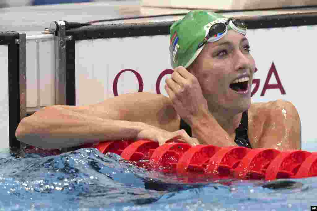 Tatjana Schoenmaker of South Africa smiles after her heat in the women's 200-meter breaststroke at the 2020 Summer Olympics, Wednesday, July 28, 2021, in Tokyo, Japan. (AP Photo/Matthias Schrader)