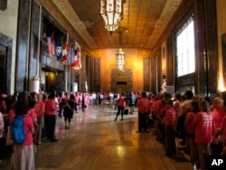 Planned Parenthood protesters hold a "stand-in" at the Louisiana Capitol in opposition to enactment of a bill to ban abortion as early as six weeks of pregnancy, May 30, 2019, in Baton Rouge.